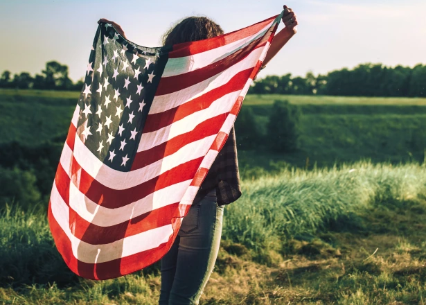 girl standing with flag